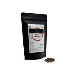 PHENIOX Kaffeebohnen Espressoblend No. 1 steht vor weißem Hintergrund. Ein kleiner Haufen Kaffeebohnen liegt daneben.